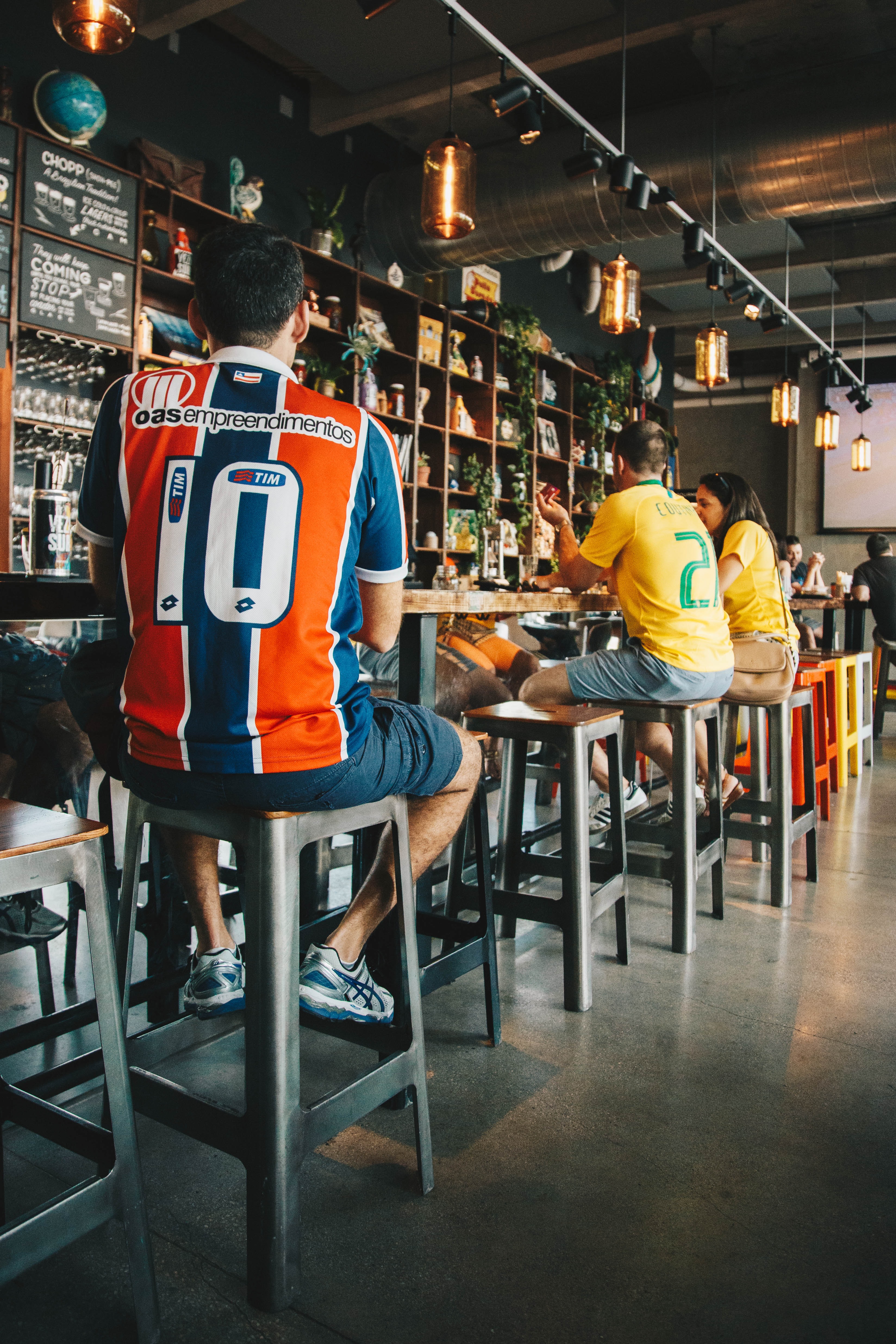 people socializing in a sports bar
