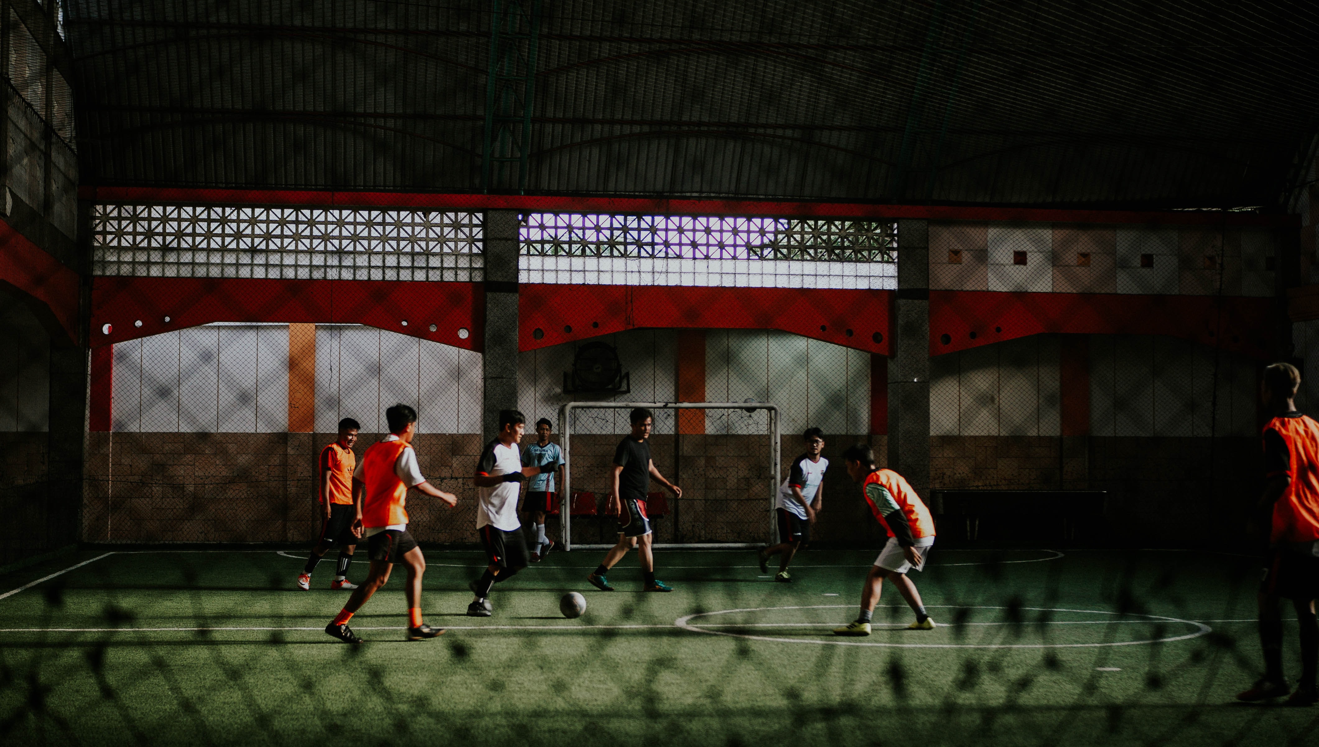 group of people playing football indoors